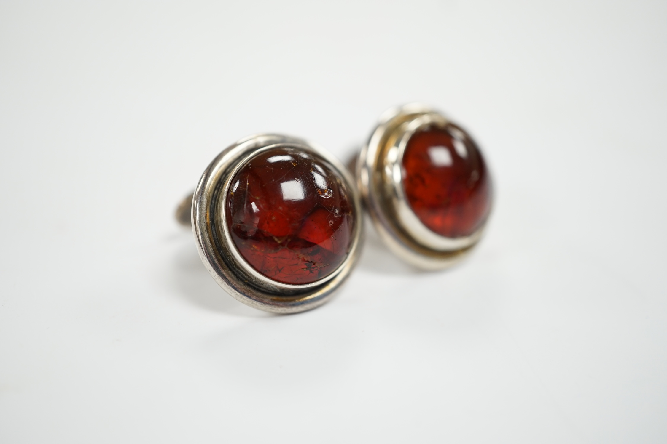 A pair of mid 20th century Danish sterling and cabochon amber set cufflinks, by Carl Ove Frydensberg, diameter 20mm.